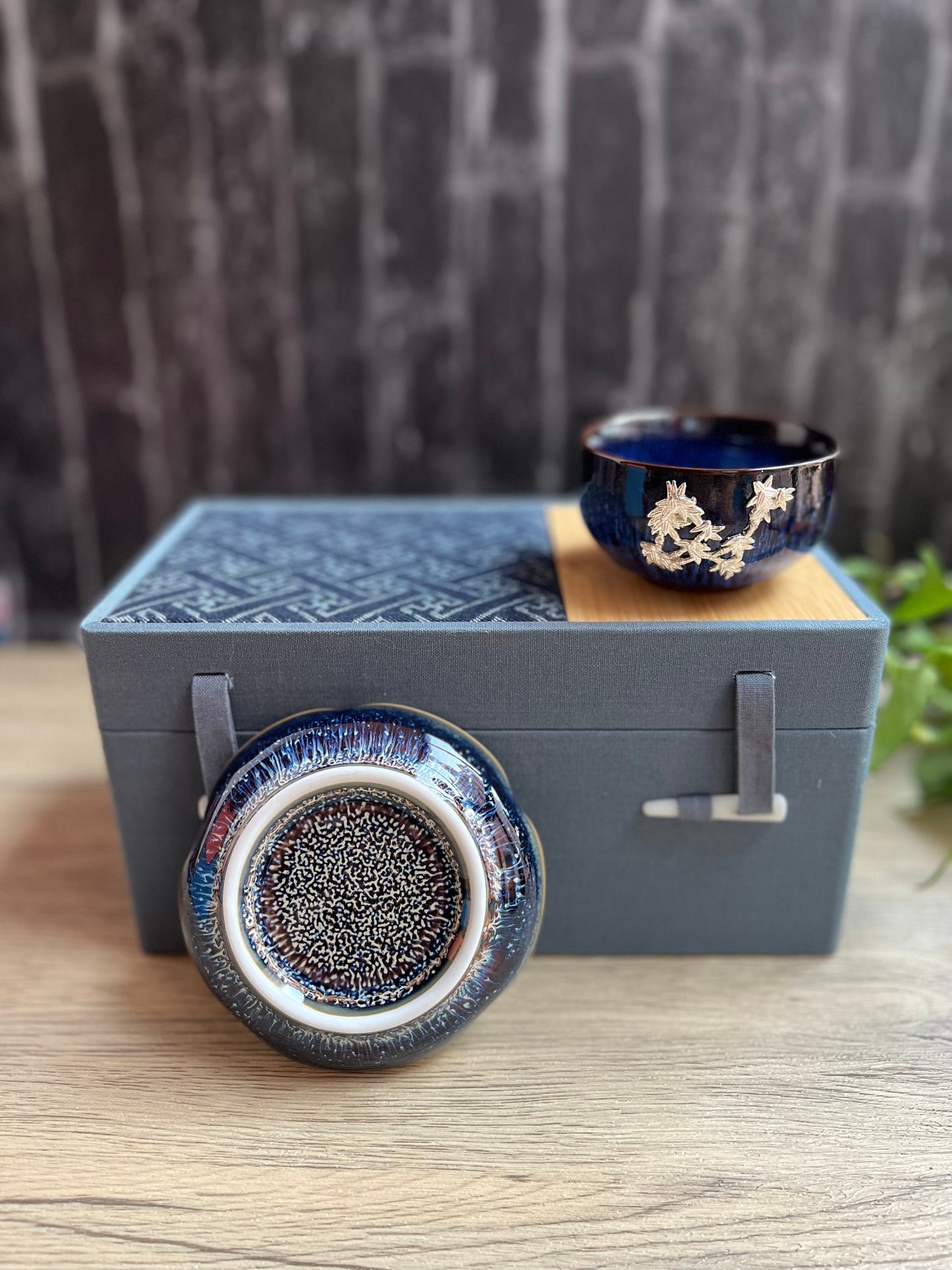 Ceramic gift set featuring tea cup and dish with detailed flower patterns and natural deep blue porcelain patterns