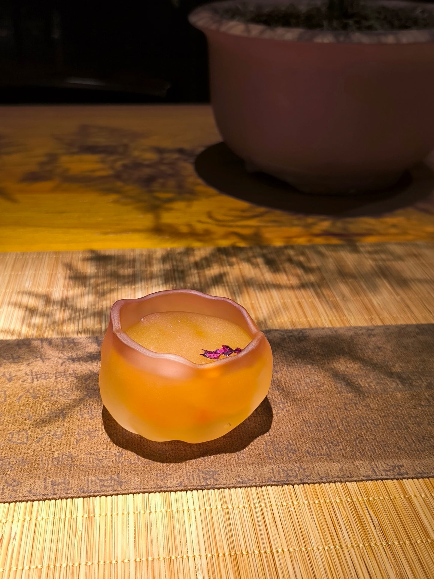 Close-up of ceramic wax melt cup with smooth handcrafted finish, soft an soothing texture