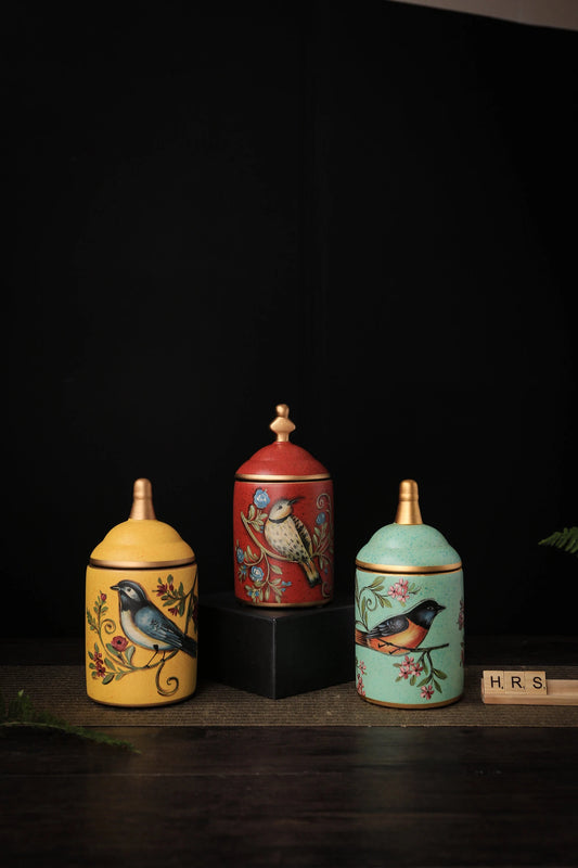 Hand-painted ceramic storage jars with bird design in yellow, green, and red retro style_by Home Relax Studio