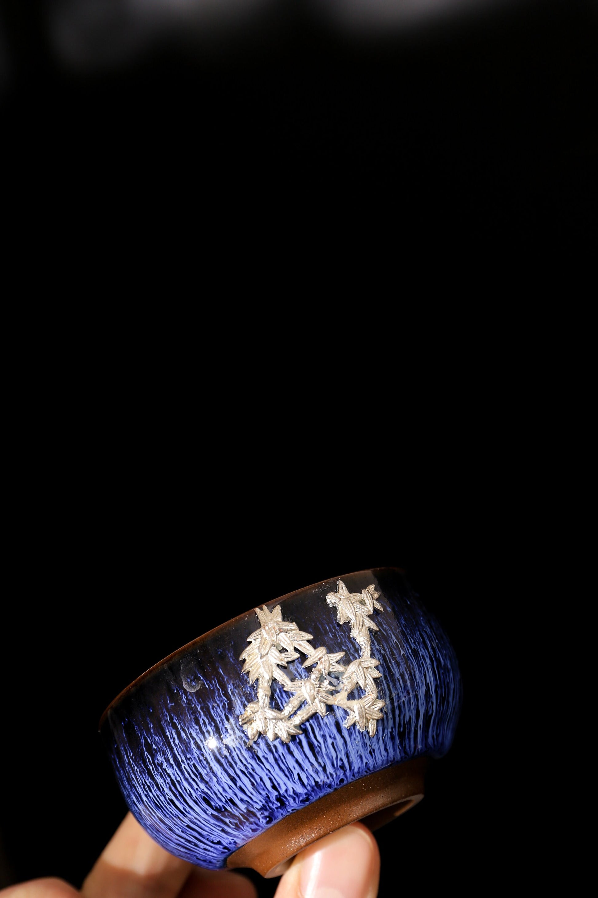 Handcrafted blue ceramic tea cup with silver maple leaf relief, traditional Japanese style kung fu tea cup