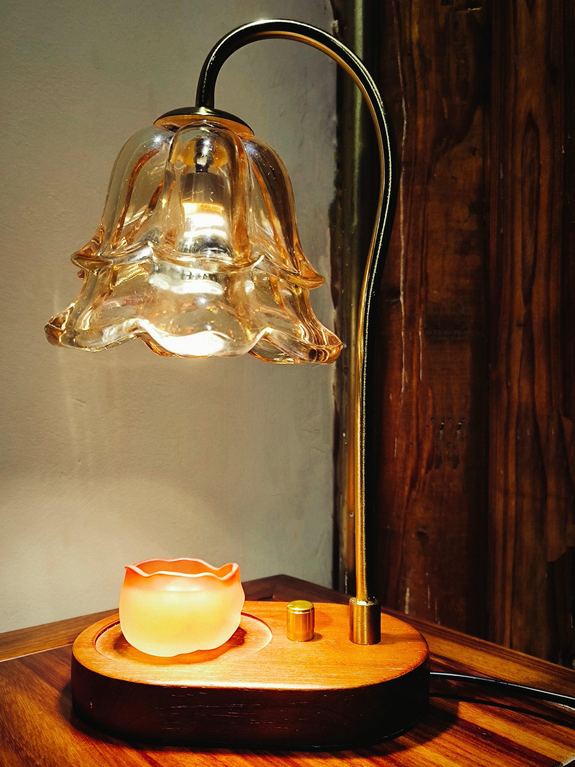Handcrafted ceramic wax melt cup placed under glass fragrance warmer lamp