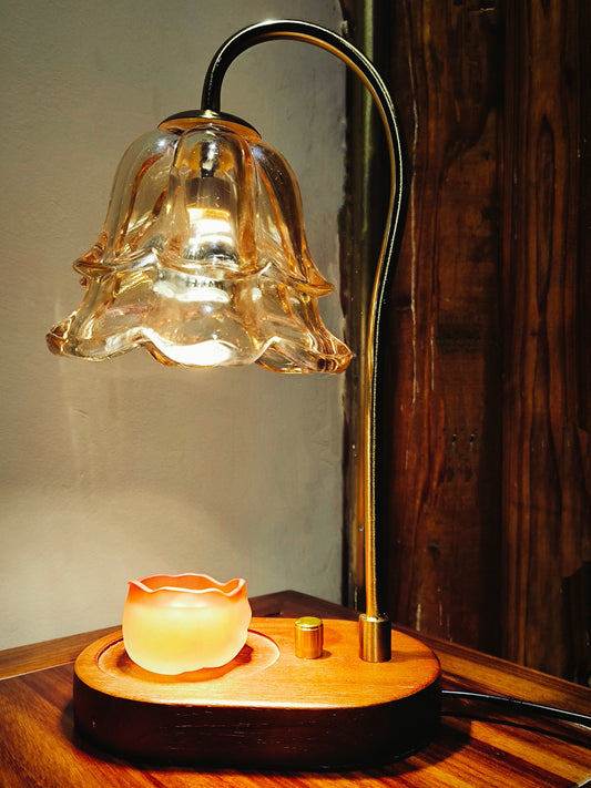 Handcrafted ceramic wax melt cup placed under glass fragrance warmer lamp