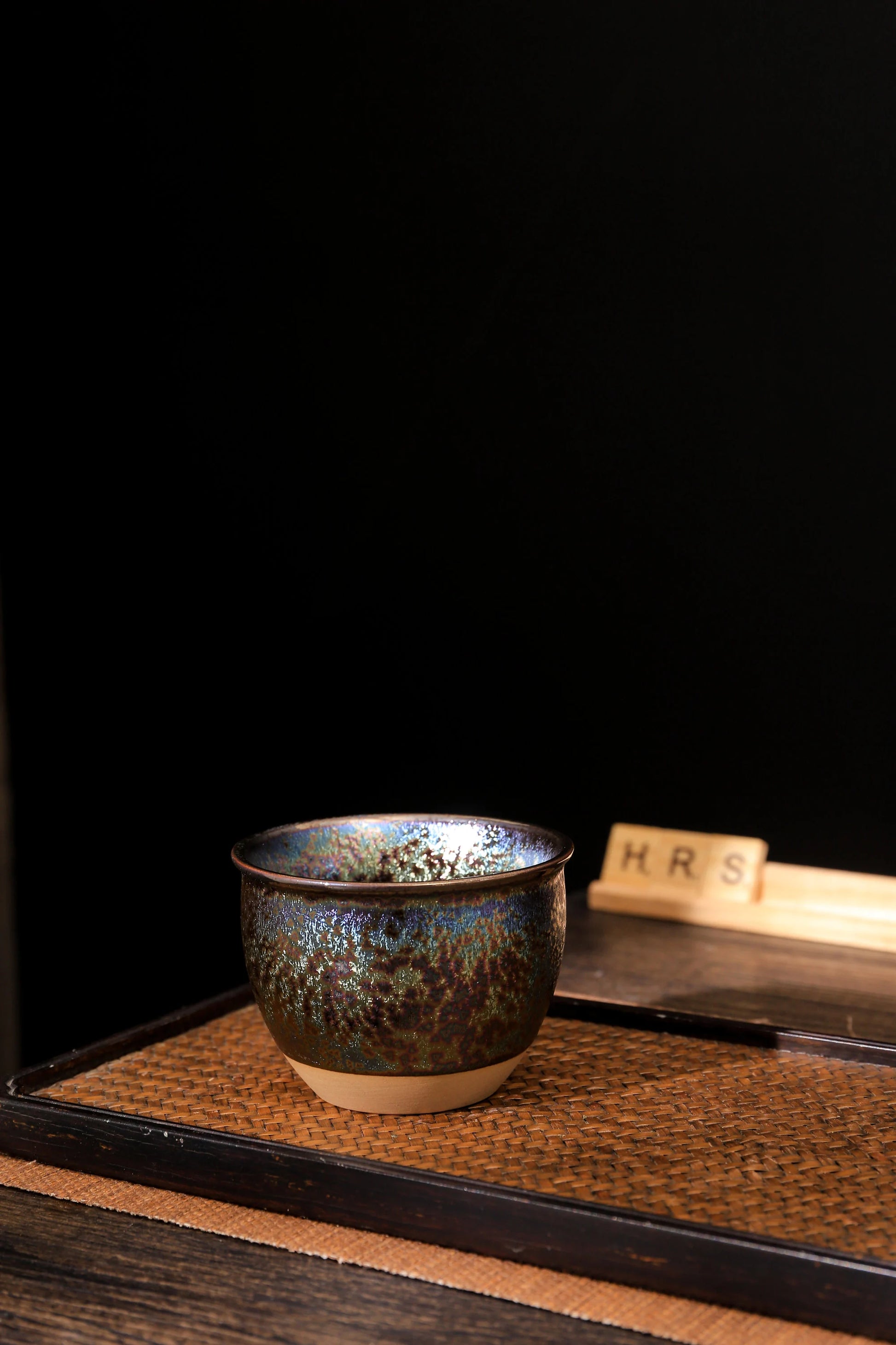 Rainbow Jian Zhan style tea cup displayed on wooden surface