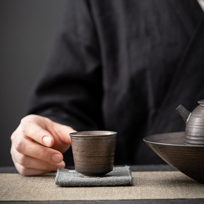 Ceramic mini tea cup with rustic brown glaze | matching teapot displayed on the side | Home Relax  Studio