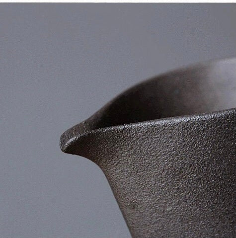 Close-up of spout design on ceramic creamer jug for precise pouring
