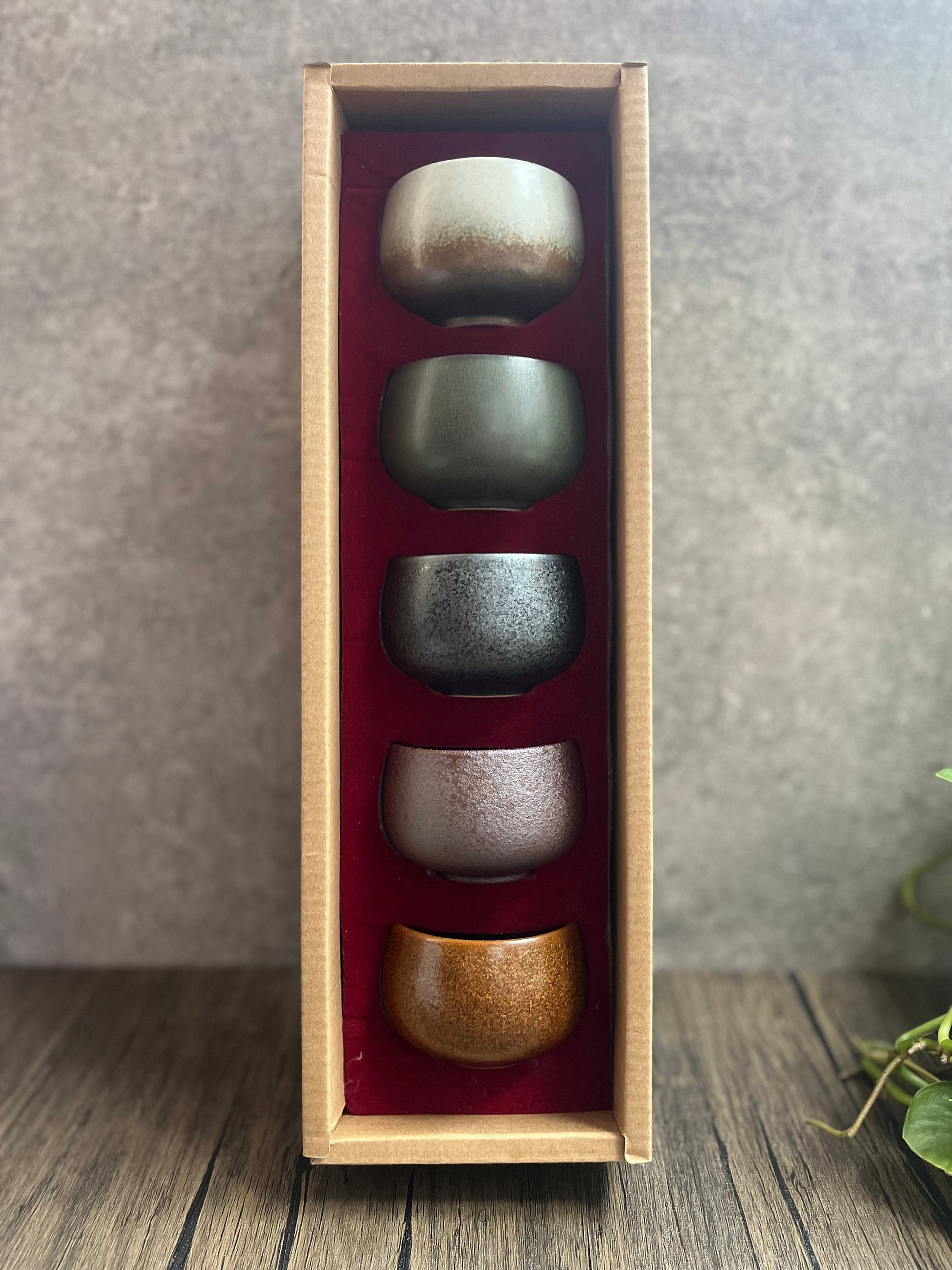 Feng Shui five element ceramic cups neatly arranged in a wooden cardboard gift box.