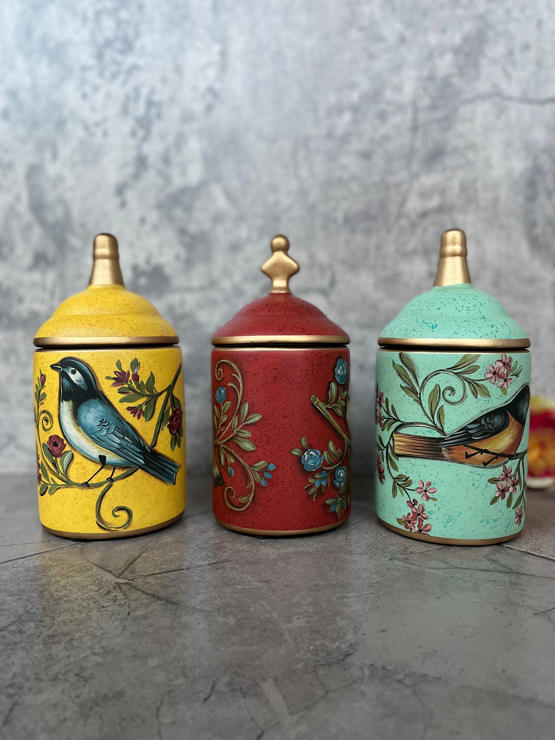 Handcrafted ceramic spice containers with bird designs in gift set presentation