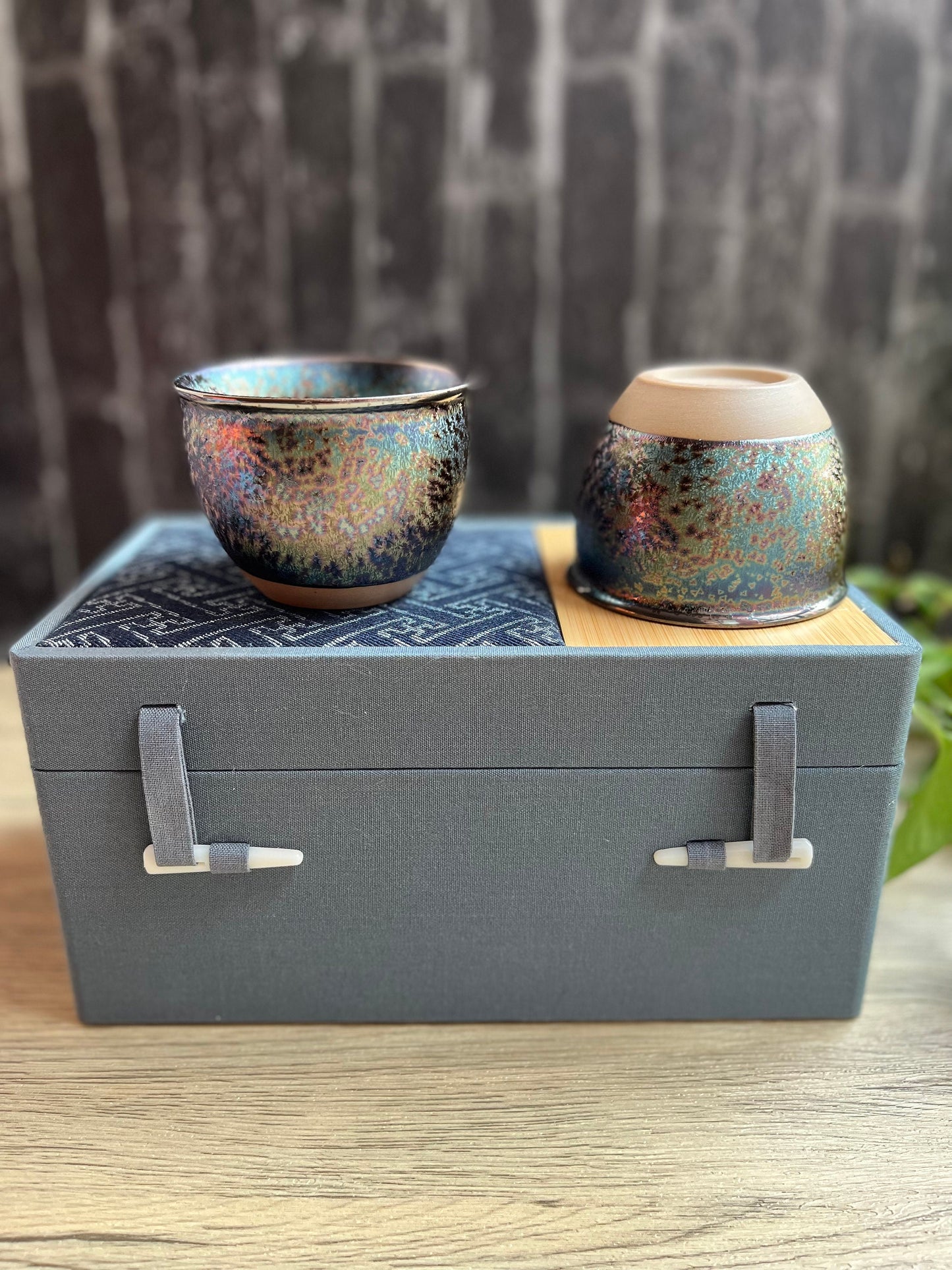 Handcrafted rainbow effect tea cups shown with matching gift box.