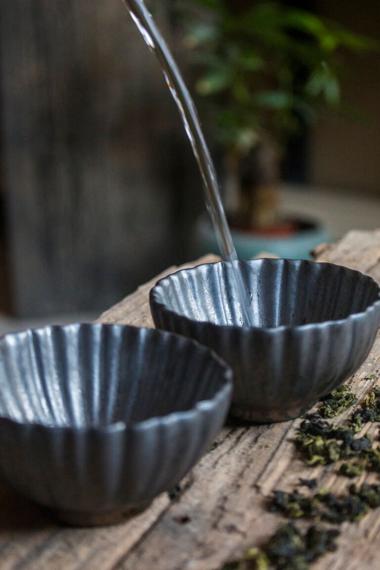 Handmade ceramic tea cups flower petal shaped wine sake cups with water pour, bronze-inspired glaze finish