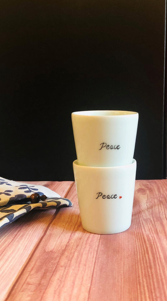 Mini ceramic cup with handwritten calligraphy text “Peace” by Home Relax Studio