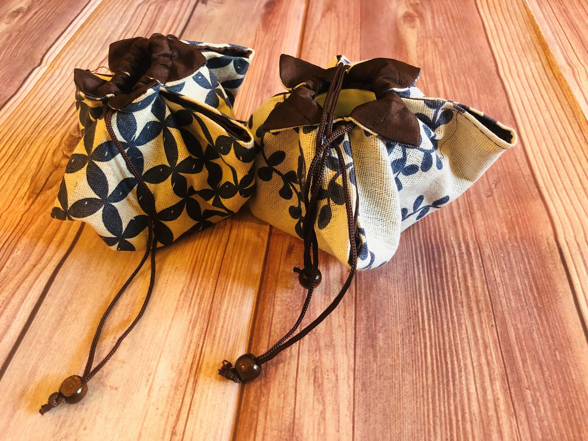 Mini ceramic cup with handwritten word and Japanese-style storage bag