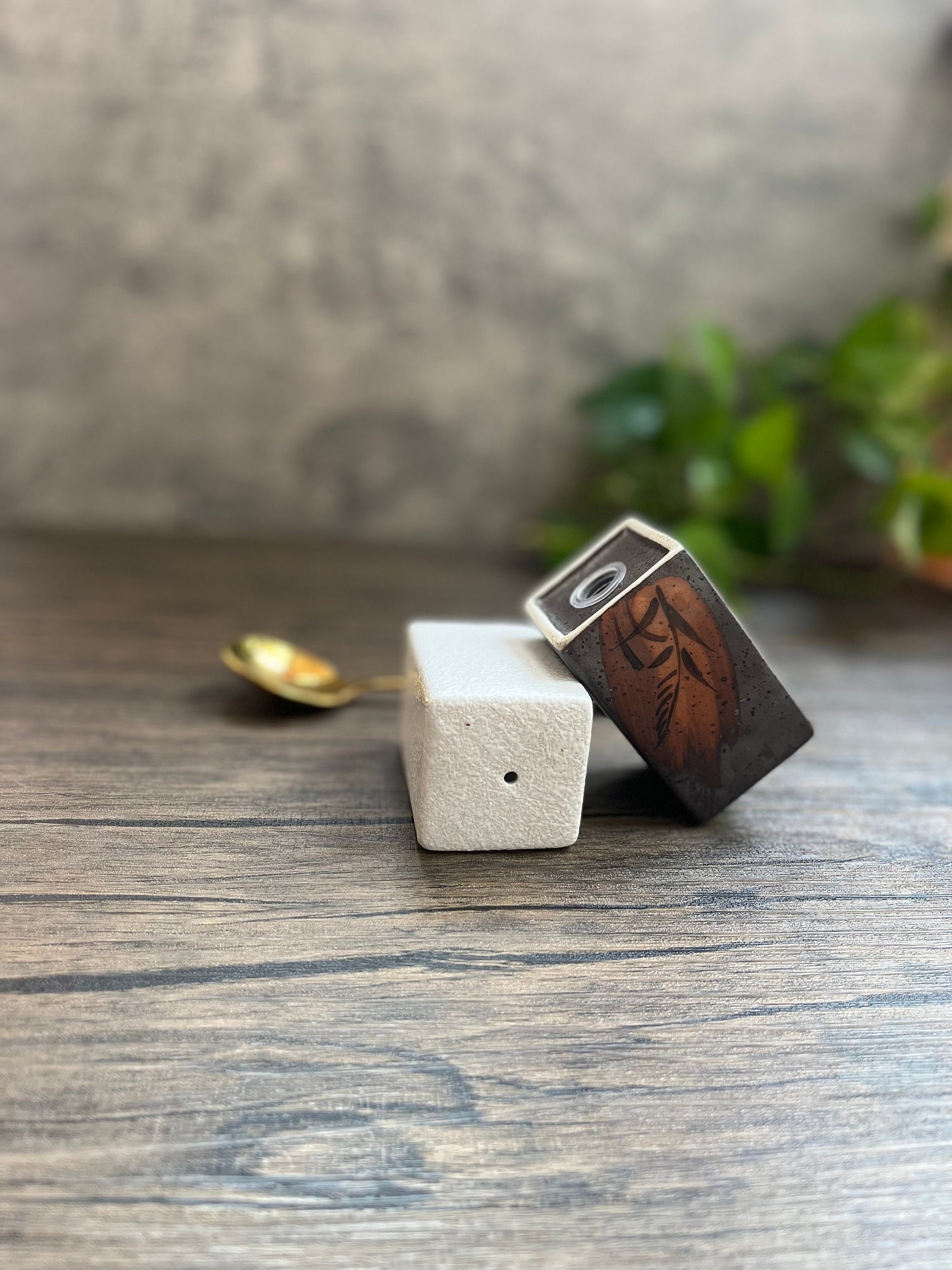 Pair of handmade ceramic salt and pepper shakers for spices, eco-friendly kitchen accessory.