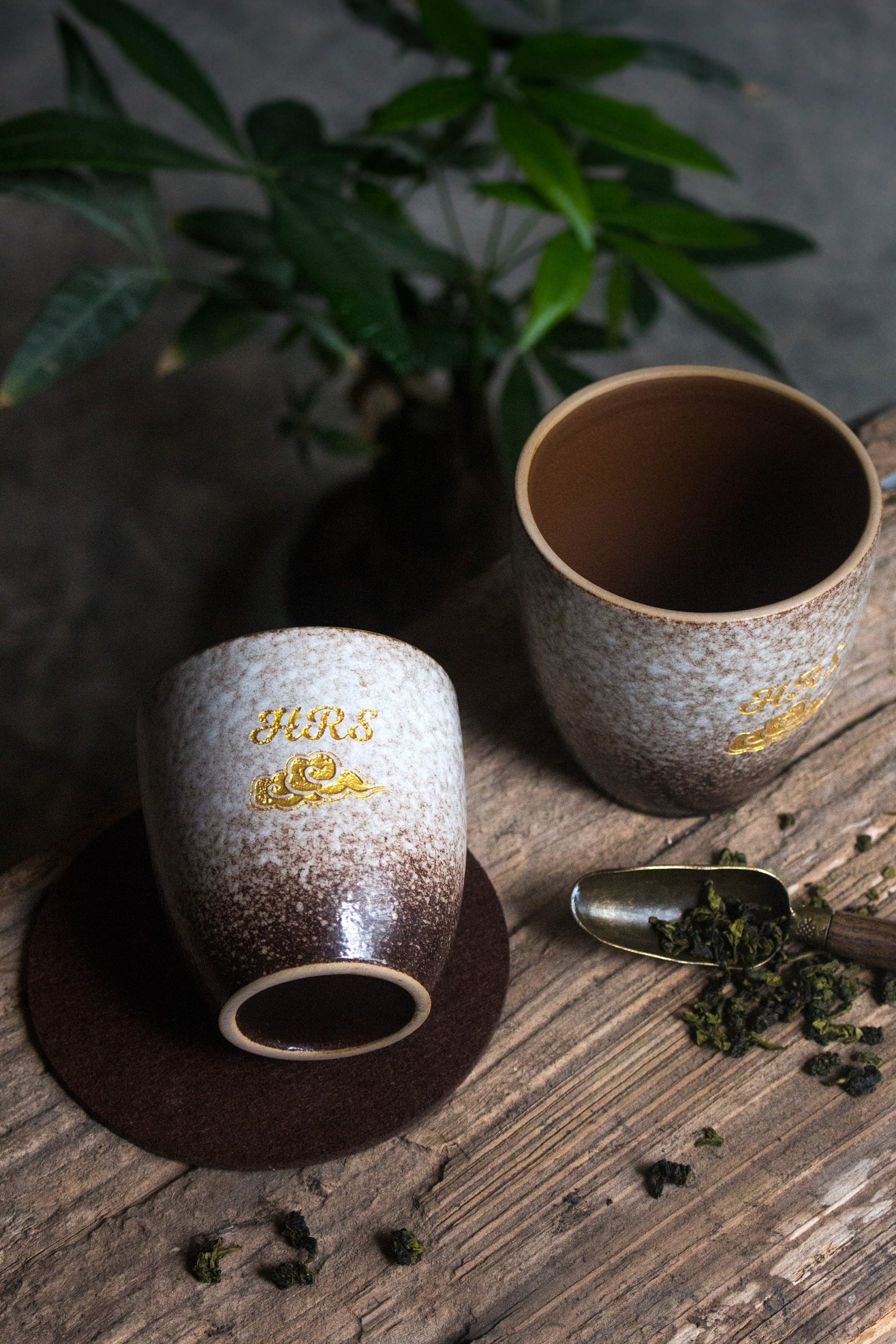 Personalized ceramic cup with golden logo design in vintage style_beige colored version cups