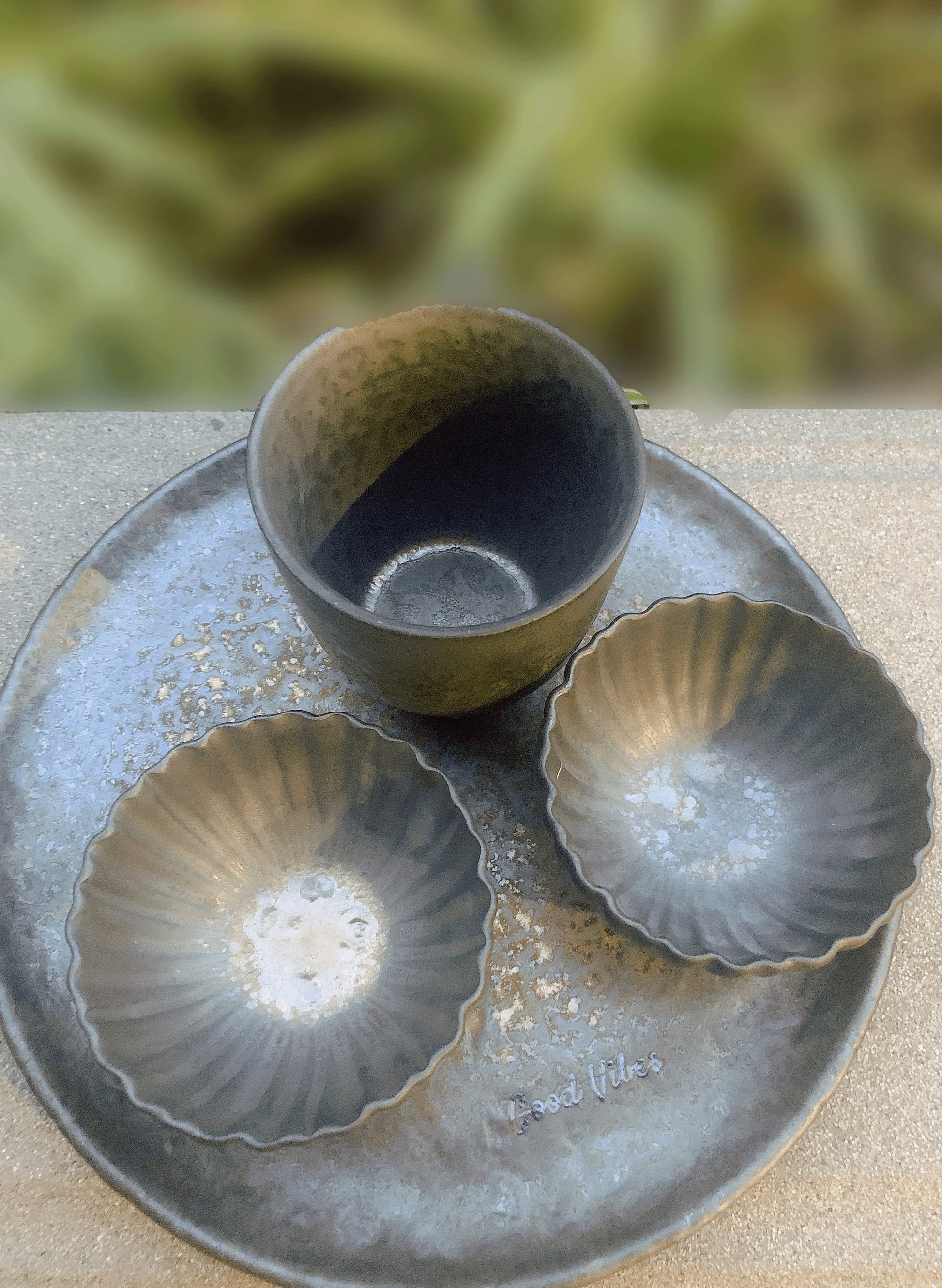 Retro ceramic cups and plate set with unique cement-like glaze_two flower petal cups with an oval cup on a matching tray