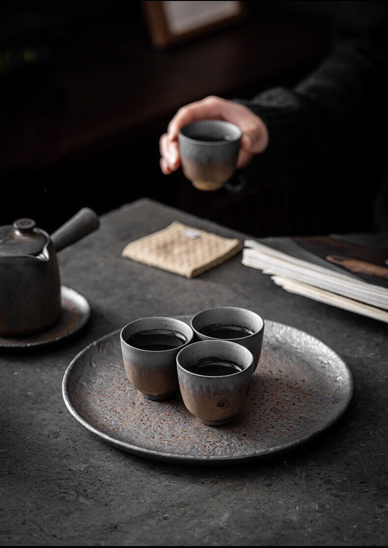 Round tea tray with silver gold glaze and natural patterns and optional matching tea cups in oval shapes