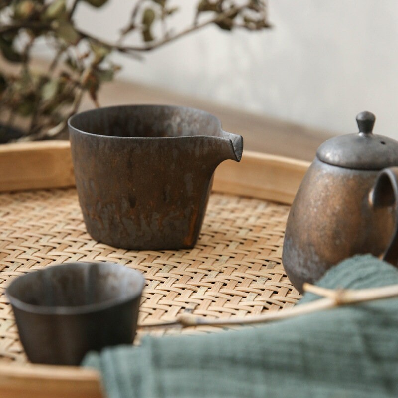 Rustic ceramic creamer pitcher paired with matching cups
