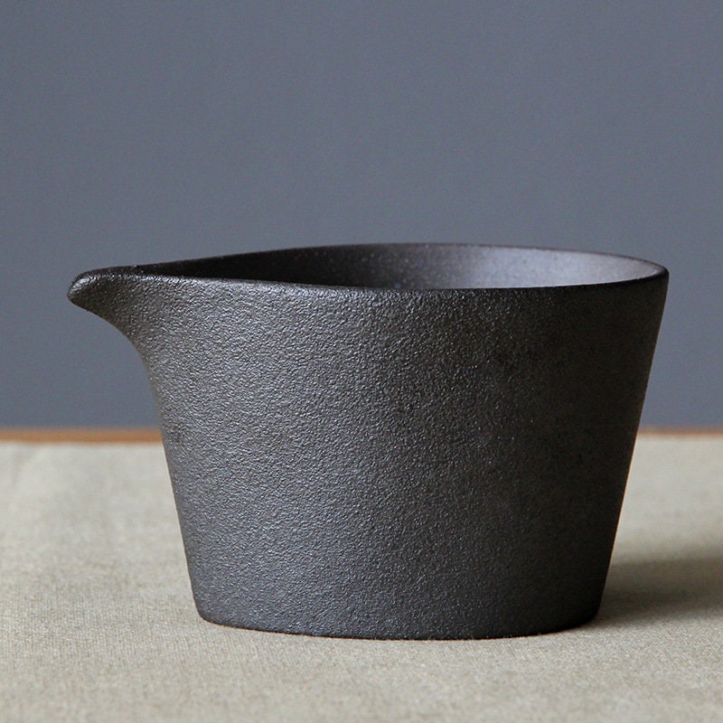 Side view of ceramic milk jug with soft vintage glaze and smooth finish_Pure black color version