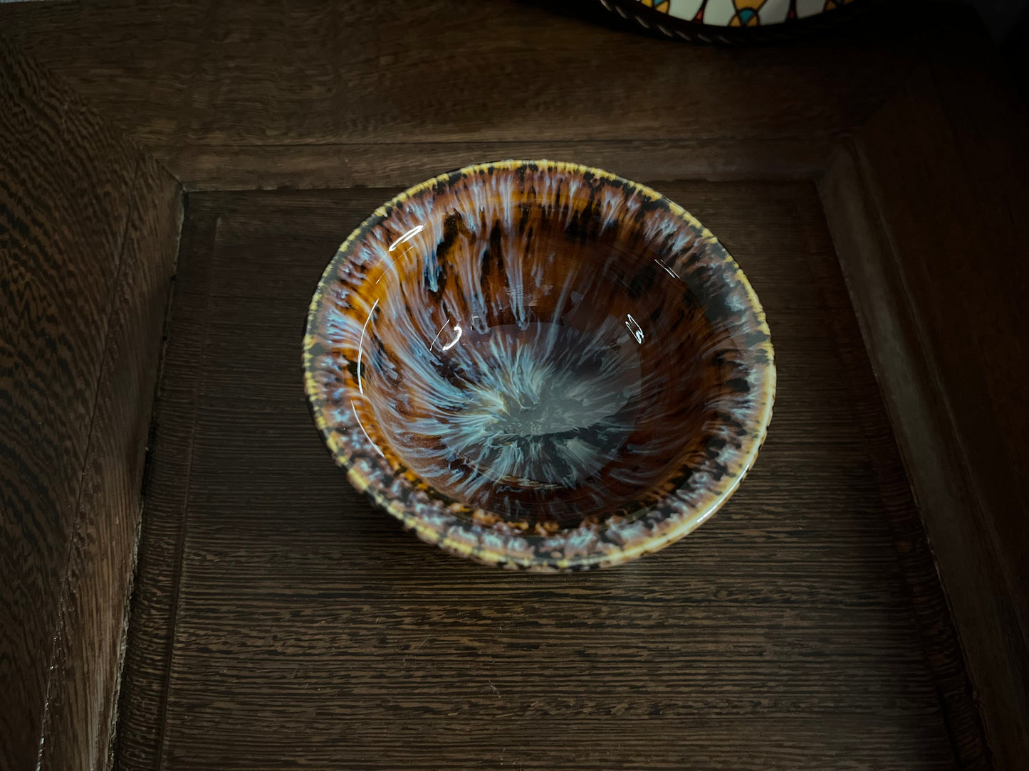 Top view of Persian-inspired ceramic tea cup with arabesque pattern inside
